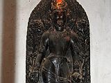 Kathmandu Patan 06 Mahabouddha Temple 03 Avalokiteshvara Sculpture A black statue of Avolokiteshvara rests inside the Mahabouddha Temple in Patan.